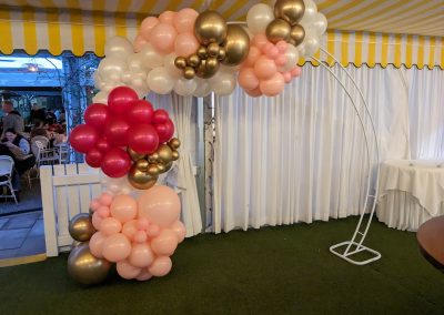 Organic half arch pink white gold on white arch frame Victoria gold park. 21st birthday balloons