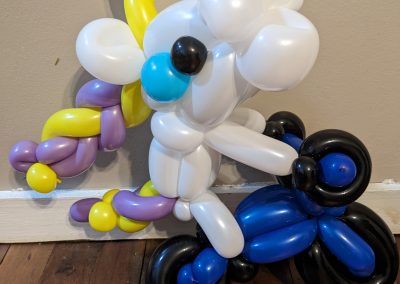 unicorn riding a motorbike balloon
